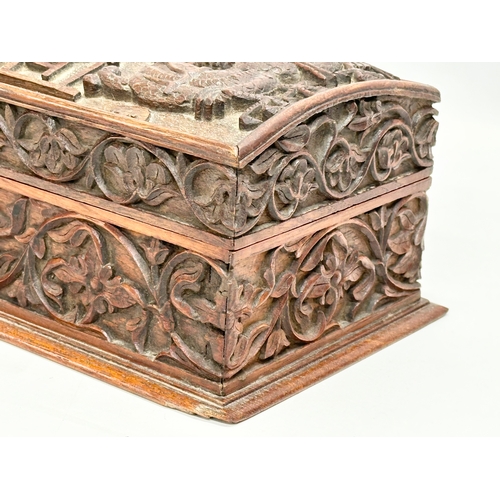 59 - A Late 19th Century Chinese carved teak casket box. 29x15x11.5cm.