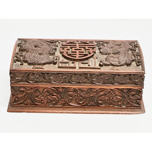 59 - A Late 19th Century Chinese carved teak casket box. 29x15x11.5cm.