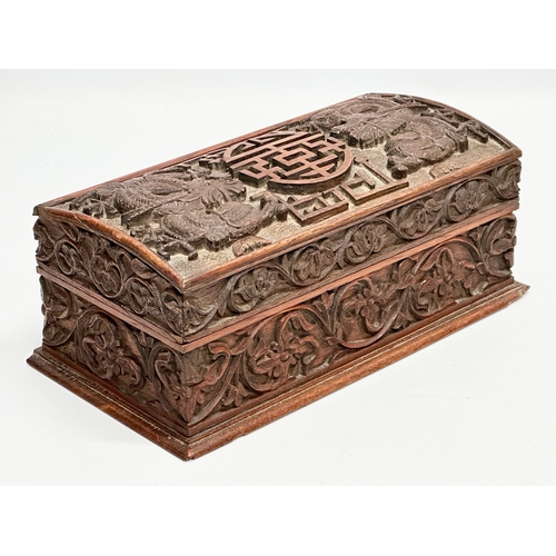 59 - A Late 19th Century Chinese carved teak casket box. 29x15x11.5cm.