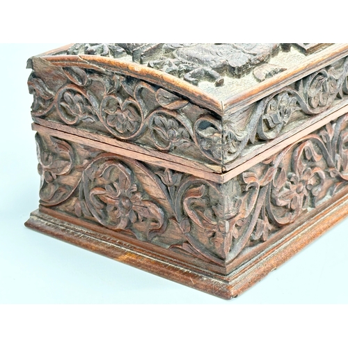 59 - A Late 19th Century Chinese carved teak casket box. 29x15x11.5cm.