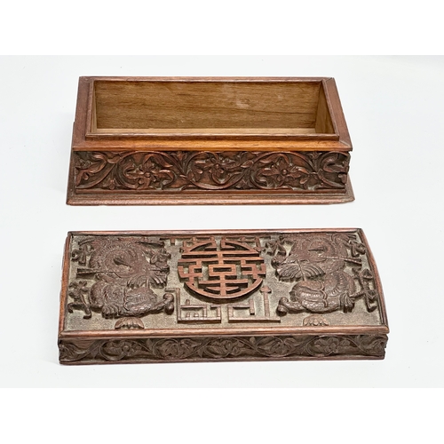 59 - A Late 19th Century Chinese carved teak casket box. 29x15x11.5cm.