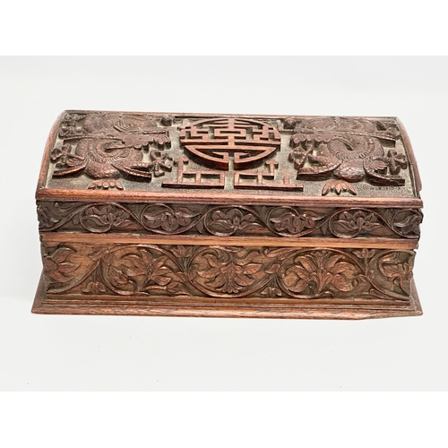 59 - A Late 19th Century Chinese carved teak casket box. 29x15x11.5cm.