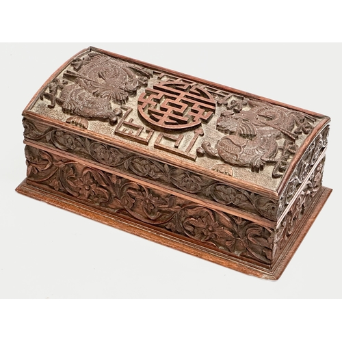 59 - A Late 19th Century Chinese carved teak casket box. 29x15x11.5cm.