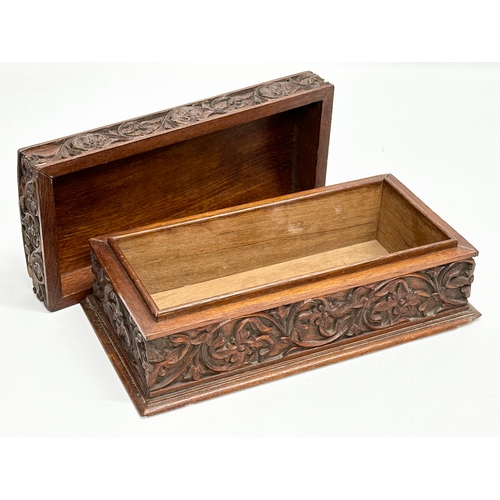 59 - A Late 19th Century Chinese carved teak casket box. 29x15x11.5cm.