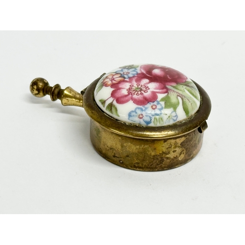 155 - 4 vintage trinket and pill boxes. Including a brass and hand painted porcelain portable ashtray. A m... 