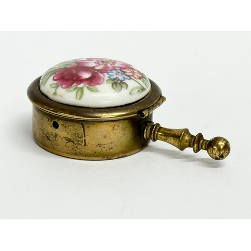 155 - 4 vintage trinket and pill boxes. Including a brass and hand painted porcelain portable ashtray. A m... 