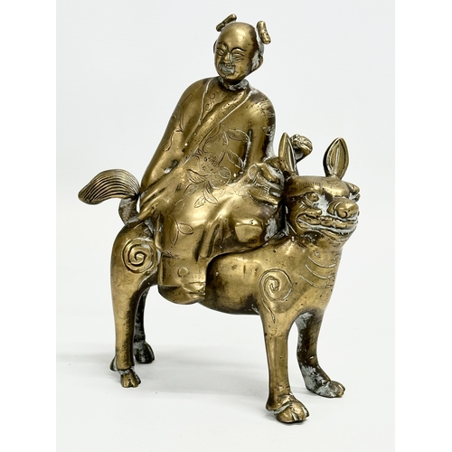 108 - A pair of Late 19th/Early 20th Century Chinese brass Foo Dogs and riders. 15x19cm.