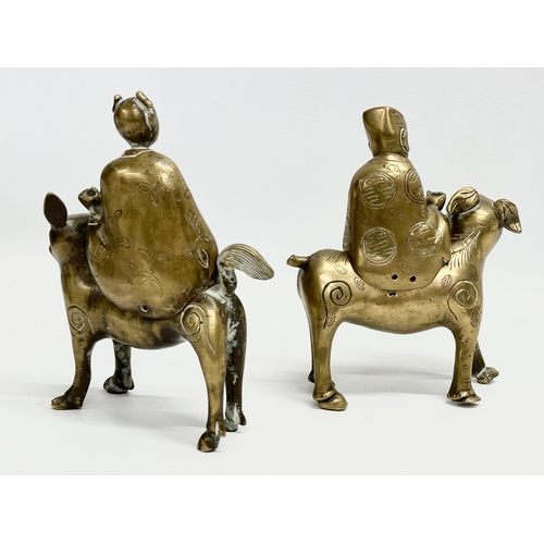 108 - A pair of Late 19th/Early 20th Century Chinese brass Foo Dogs and riders. 15x19cm.