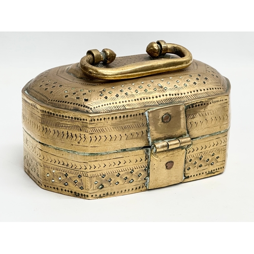 109 - A Late 19th Century Indian brass Paan box. 18x15x11cm