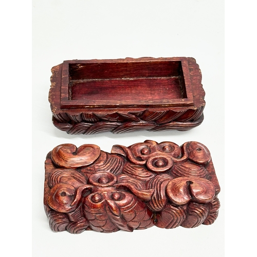 110 - An Early 20th Century Chinese carved boxwood trinket box with koi fish relief. 12.5x7x6.5cm