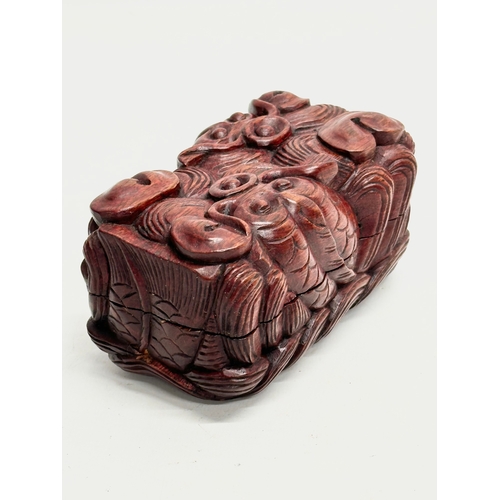 110 - An Early 20th Century Chinese carved boxwood trinket box with koi fish relief. 12.5x7x6.5cm