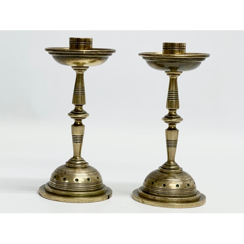 134 - A pair of good quality Late 19th Century brass candlesticks. 16cm