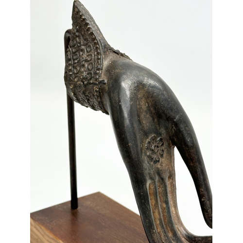 167 - An Early 20th Century Indian bronze Buddha hand on later rosewood base. 14.5x18.5cm.