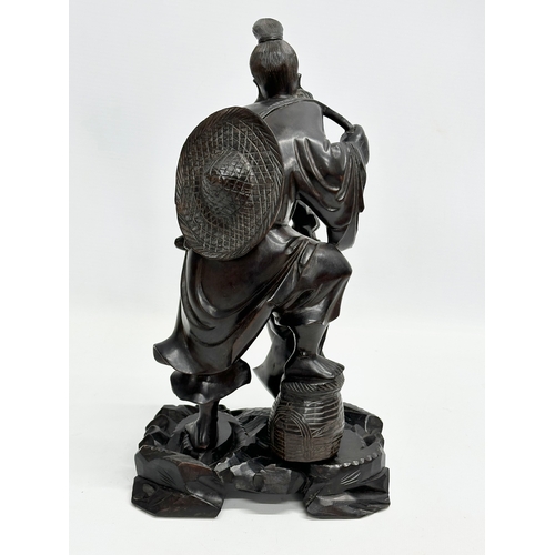 185 - A good quality signed Early 20th Century Chinese fisherman on stand. 16x12x29cm