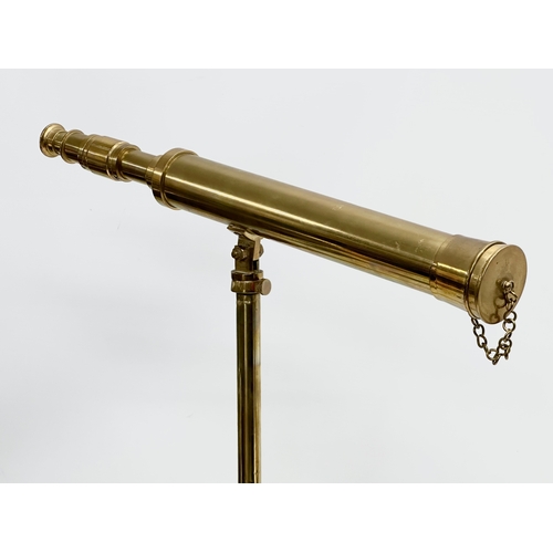 189 - A brass tabletop telescopic telescope. 61cm extended.