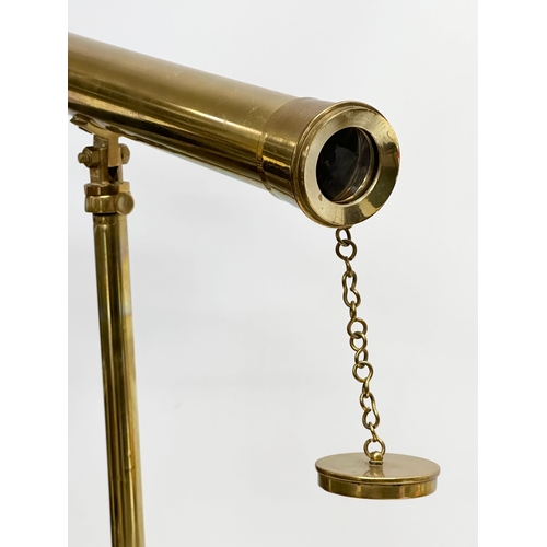 189 - A brass tabletop telescopic telescope. 61cm extended.