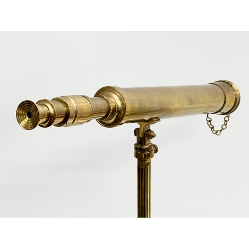 189 - A brass tabletop telescopic telescope. 61cm extended.