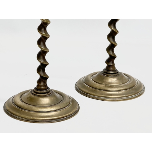 135 - A pair of large Victorian brass barley twist candlesticks. 14.5x37cm.