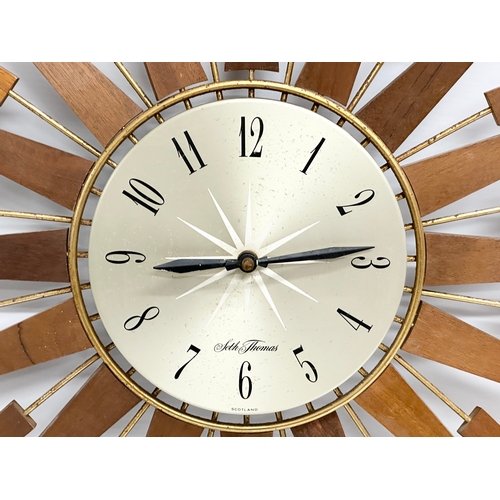 115 - A 1960’s Seth Thomas Mid Century teak sunburst clock. 66cm