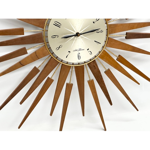 115 - A 1960’s Seth Thomas Mid Century teak sunburst clock. 66cm