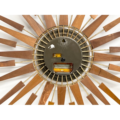 115 - A 1960’s Seth Thomas Mid Century teak sunburst clock. 66cm