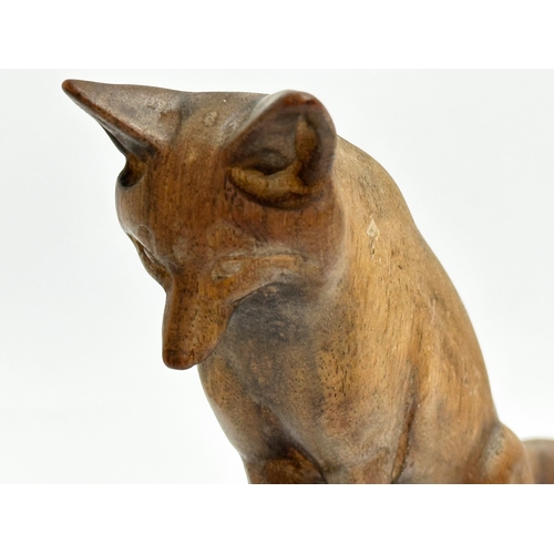 205 - A Late 19th Century wooden fox. 19x10cm.