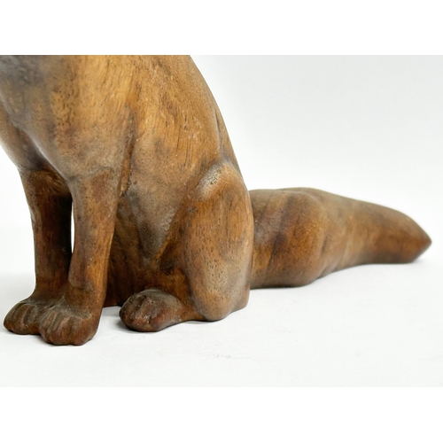 205 - A Late 19th Century wooden fox. 19x10cm.