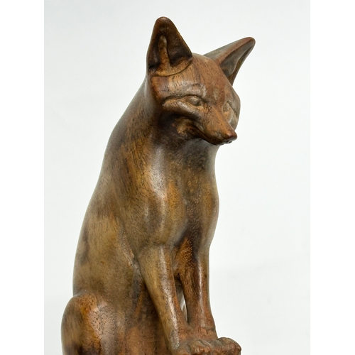 205 - A Late 19th Century wooden fox. 19x10cm.