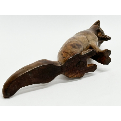 205 - A Late 19th Century wooden fox. 19x10cm.