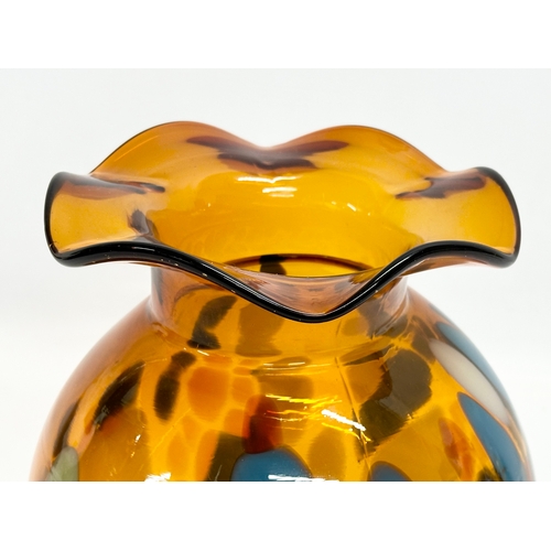 62A - A Mid 20th Century amber splatter glass vase with frilled rim. 19x22cm.