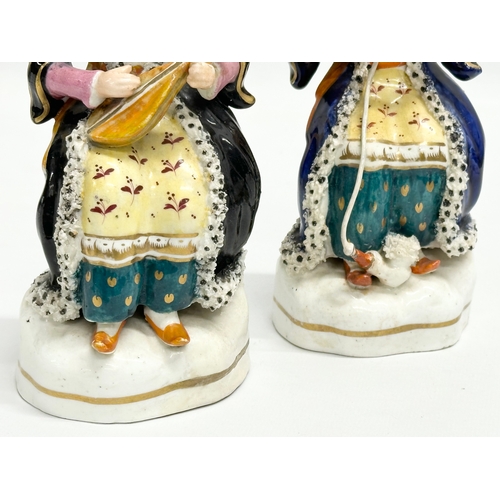 222 - A pair of Early/Mid 19th Century Staffordshire pottery Turkish style figurines. 20cm