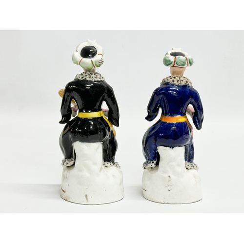 222 - A pair of Early/Mid 19th Century Staffordshire pottery Turkish style figurines. 20cm