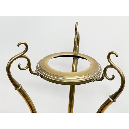 30 - William Soutter and sons. A Late 19th Century Art Nouveau brass jardiniere on stand. 46x46x70cm.