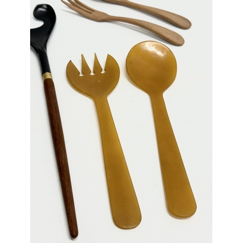 117A - A pair of Danish Mid Century teak food servers with others.