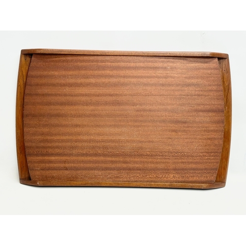 117B - A Mid Century teak serving tray. 58x35cm