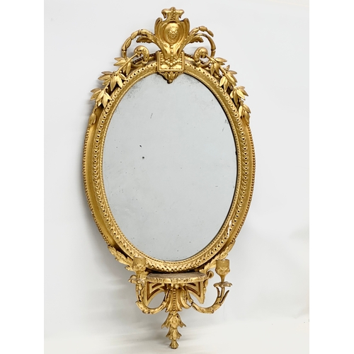 14 - An Early 19th Century Regency gilt framed Girandole mirror. Circa 1810. 49x94cm