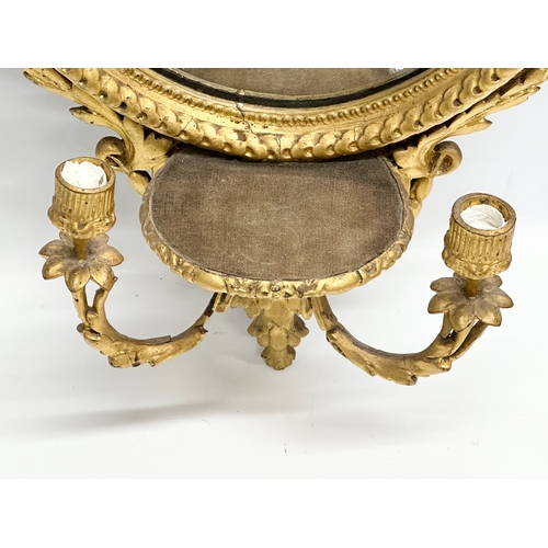 14 - An Early 19th Century Regency gilt framed Girandole mirror. Circa 1810. 49x94cm