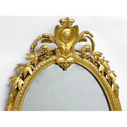 14 - An Early 19th Century Regency gilt framed Girandole mirror. Circa 1810. 49x94cm