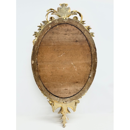 14 - An Early 19th Century Regency gilt framed Girandole mirror. Circa 1810. 49x94cm