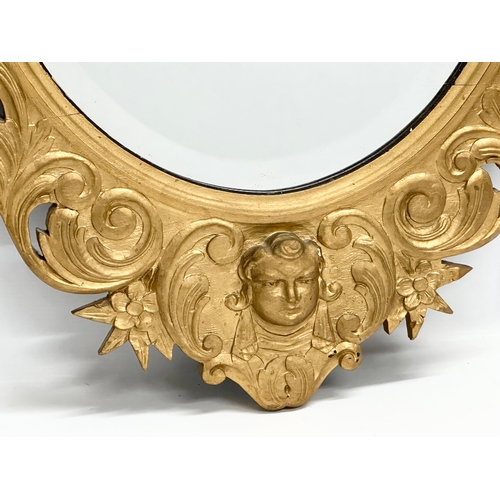 244 - An Early 20th Century gilt wooden framed bevelled mirror. 65x91cm.