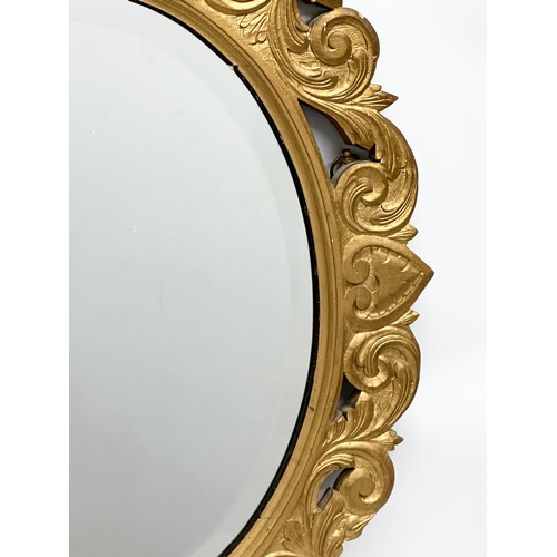 244 - An Early 20th Century gilt wooden framed bevelled mirror. 65x91cm.