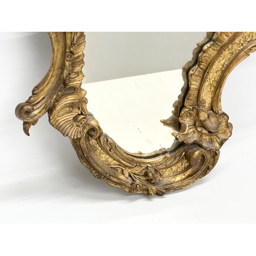 230 - A 19th Century Victorian gilt framed Rococo style mirror. 58x83cm