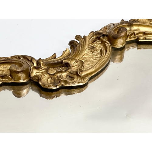 230 - A 19th Century Victorian gilt framed Rococo style mirror. 58x83cm