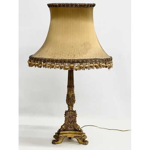 245 - A Mid 20th Century French Empire style gilt table lamp. 71cm