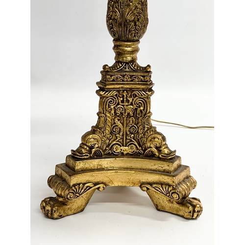 245 - A Mid 20th Century French Empire style gilt table lamp. 71cm