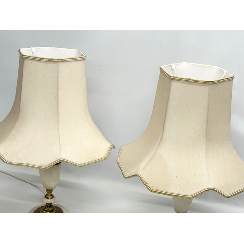 246 - A pair of Mid 20th Century alabaster and brass table lamps. 59cm