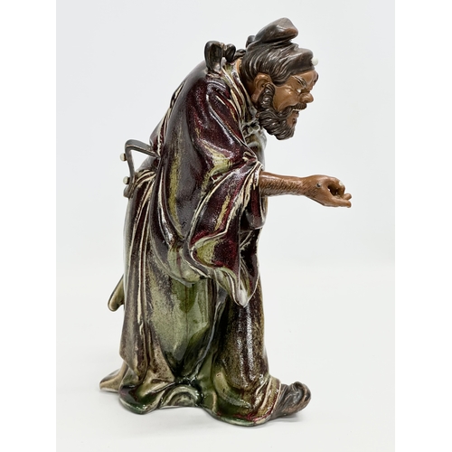 240 - Shiwan. A large signed 20th Century Chinese Shiwan Pottery figure of Zhong Kui. Impressed mark. 22x3... 