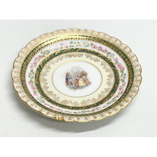 253 - A pair of Early 20th Century Rococo hand painted cups and saucers.