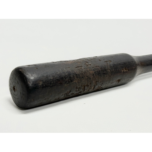 258 - A 19th Century ebony police truncheon. 28cm