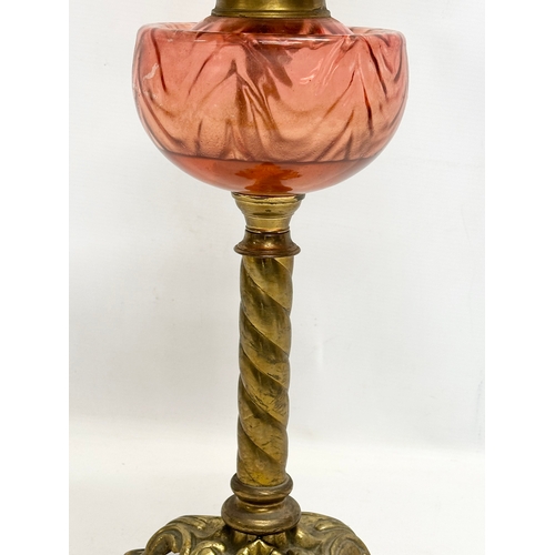 264 - A large Late 19th Century Victorian double burner oil lamp. With brass column and cranberry glass bo... 